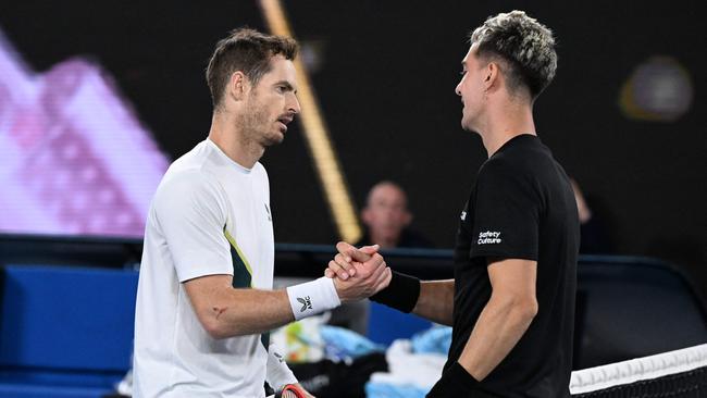 Andy Murray (L) greets Thanasi Kokkinakis at the net after the match. Picture: William West/AFP