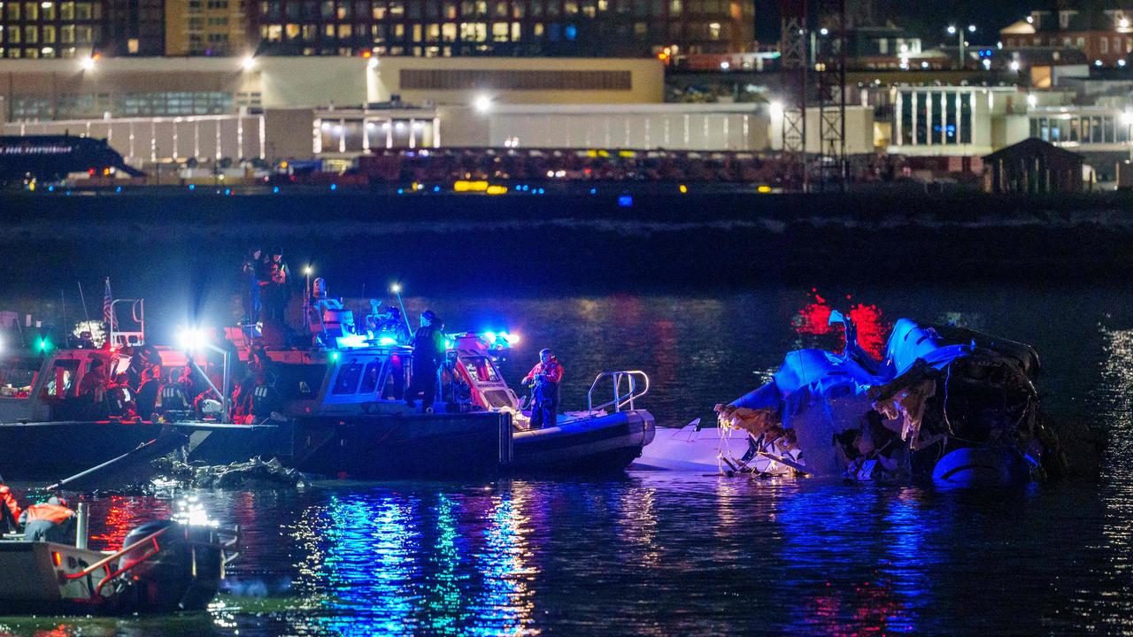 Emergency response teams including Washington, DC Fire and EMS, DC Police and others, as airplane wreckage in the Potomac River near Ronald Reagan Washington Airport.