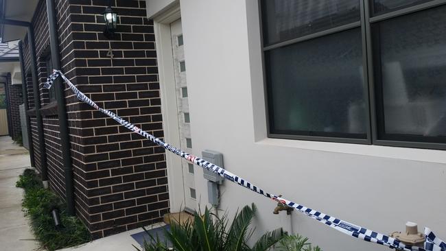 Police tape is draped across Ms Yu’s front door. Picture: Ben Graham