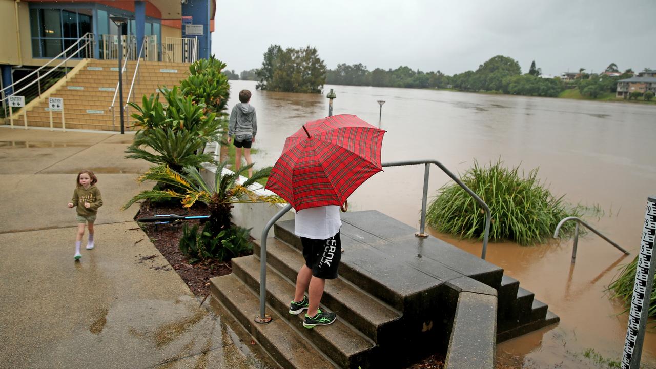 Heavy rain continues to batter the NSW mid north coast causing major flooding. Kempsey residents check the water levels at the towns levy wall . Nathan Edwards