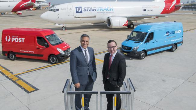 Australia Post chief executive Ahmed Fahour and Qantas chief Alan Joyce with the StarTrack freighter aircraft. Picture: James Morgan