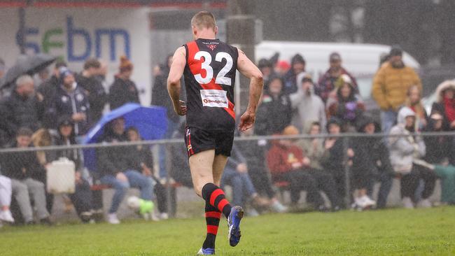 Nathan Buckley trots off with a hamstring injury. Picture: Ian Currie