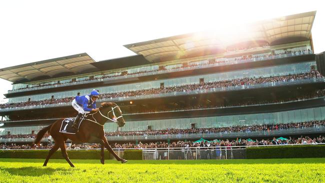 For the final time, Winx crosses the finish line first. Picture: Matt King/Getty Images