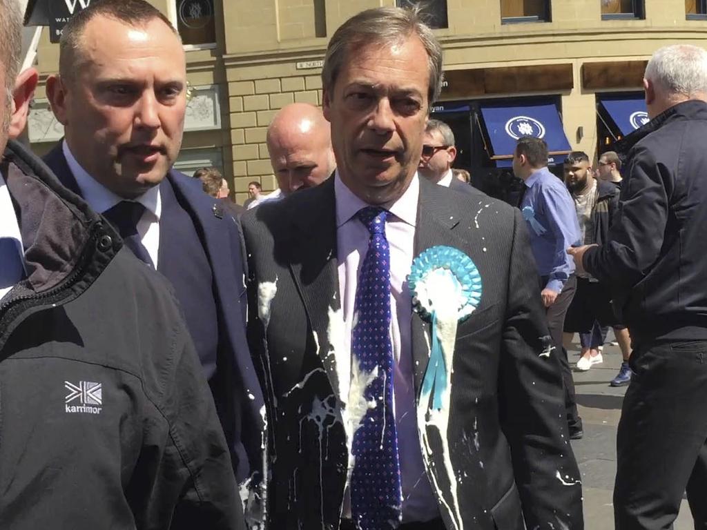 Brexit Party leader Nigel Farage after being hit with a milkshake during a campaign walkabout for the upcoming European elections in Newcastle, England, Monday May 20, 2019. (Tom Wilkinson/PA via AP)
