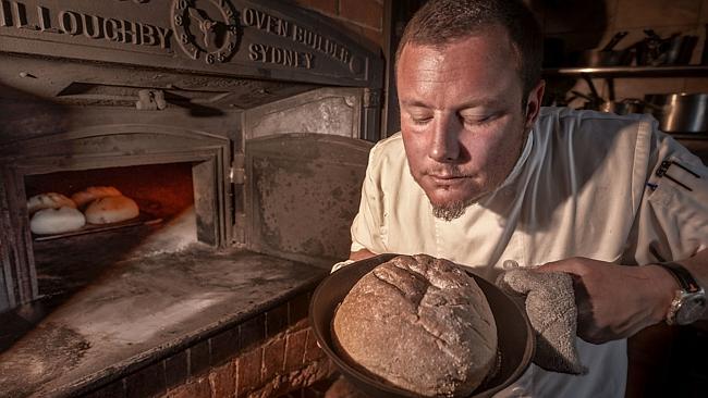 Consultant chef Misha Laurent checks a loaf baked in the Vesta oven.