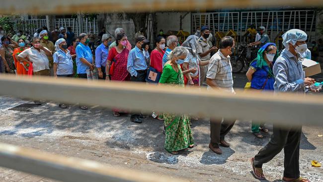 People in Mumbai queue up to get vaccinated. Picture: Punit Paranjpe/AFP