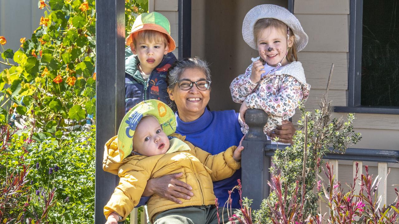 Elijah Usher, Georgette Ahfock and Darcy Stepanoff with Scott Paterson in foreground. Georgette Ahfock is recognised for her commitment to excellence in early childhood education and care. Picture: Nev Madsen.