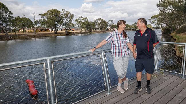 Jennie and Douglas Mitchell at a spot on the Wimmera River where they hang out with friends in Horsham. ‘When we were on the farm, you always had to drive at least half an hour to get somewhere – now in a couple of seconds, I’m in town,’ says Jennie. Picture: Nadir Kinani