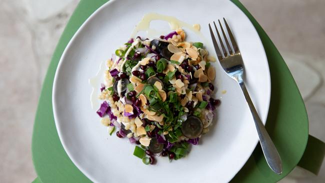 Organic couscous, pomegranate, cabbage, cherry tomato salad with tahini dressing and fresh herbs. Picture: David Kelly