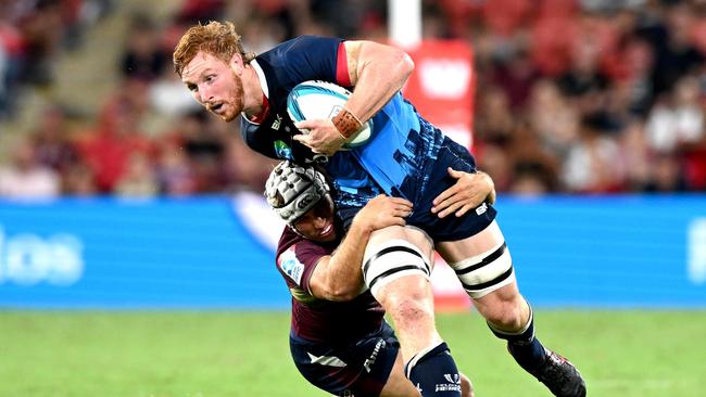 Brad Wilkin of the Rebels attempts to break away from the defence during the round one Super Rugby Pacific match between the Queensland Reds and the Melbourne Rebels at Suncorp Stadium on February 19, 2022 in Brisbane, Australia. (Photo by Bradley Kanaris/Getty Images)