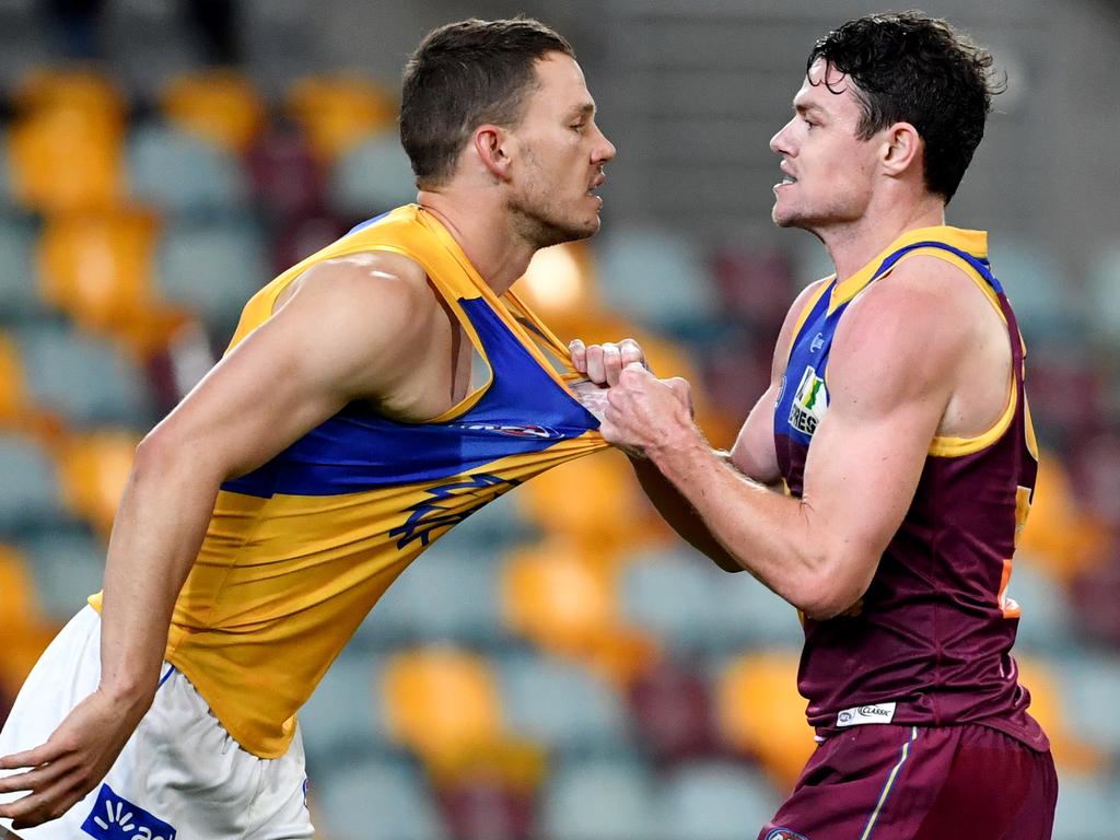 The Eagles’ Jack Redden (left) tussles with Brisbane’s Lachie Neale. Picture: AAP Image/Darren England