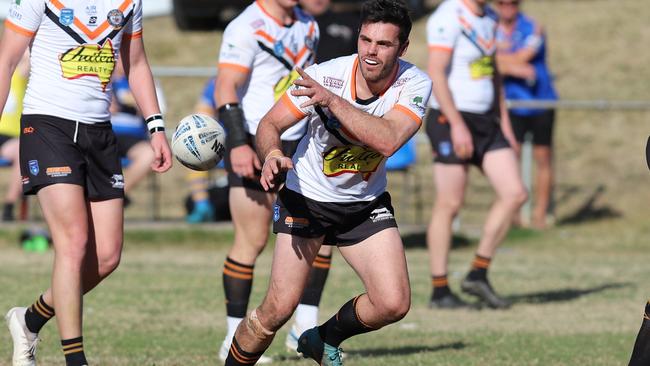 Nathan Rumsby fires out a pass for The Oaks Tigers. Picture: Steve Montgomery