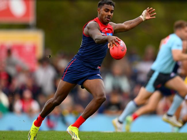 MELBOURNE, AUSTRALIA - FEBRUARY 18: Kysaiah Pickett of the Demons kicks the ball during an AFL practice match between Melbourne Demons and Richmond Tigers at Casey Fields on February 18, 2024 in Melbourne, Australia. (Photo by Morgan Hancock/Getty Images)