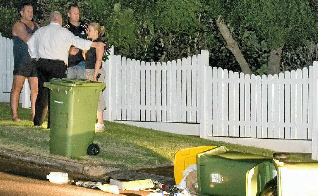 Police talk to witnesses after a detective was dragged alongside a stolen car and injured in Barry St. Picture: Kevin Farmer