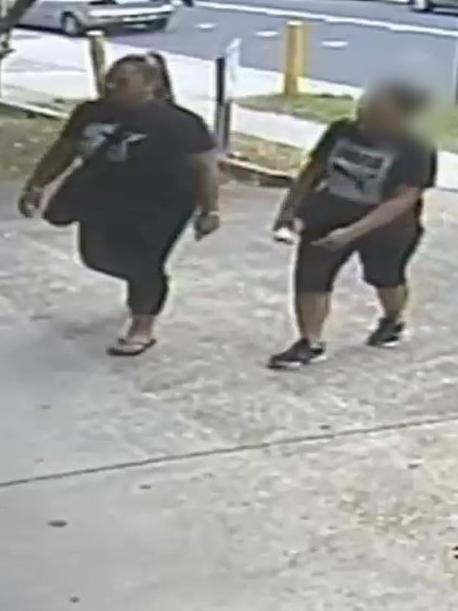 The woman walks into St Vincent de Paul with Analosa Ah Keni. Source: NSW police