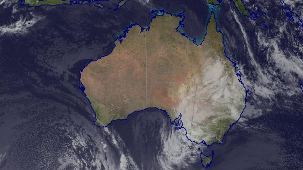 A thick cloud band forming over Australia’s biggest cities heralds a cold and wet start to school holidays in NSW and the ACT. Picture: Bureau of Meteorology