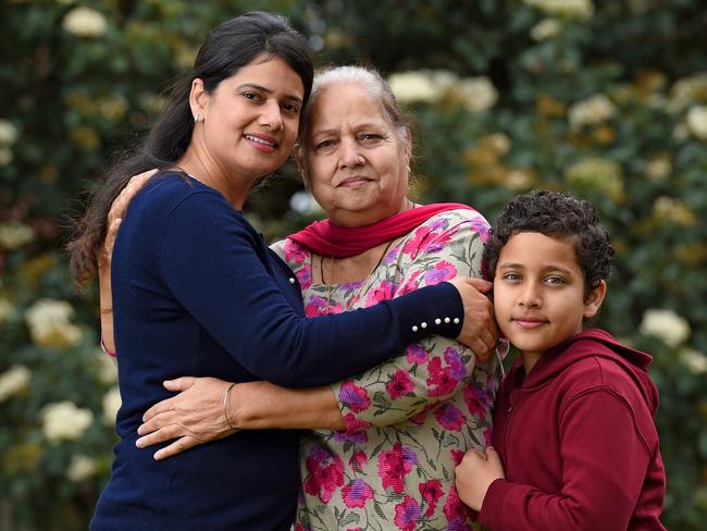 27/9/18 - Preet Rakhra, son Abir Rakhra, 10, and mother Balbir Kaur at their home in Parkside. Preet is a single mum who moved to Australia in October 2014. Her mother came out in January 2015 to help the family but under the long stay visa is forced to make two trips back to India for six months at a time which the family find difficult. They would like for the long stay visa to be extended. Photo - Naomi Jellicoe