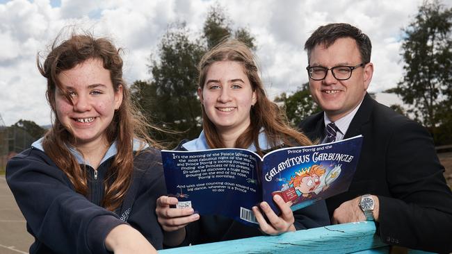 Former Endeavour College principal Glyn Roberts with his daughters when he launched one of his children’s books in 2017.