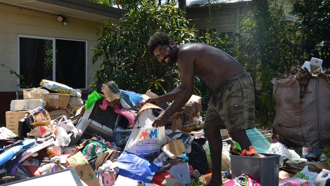 Michael Saveka was cheerful despite the entire contents of his family home at Machans Beach being destroyed, saying he is grateful no harm came to them. Picture: Bronwyn Farr