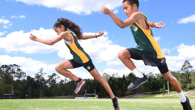 Athletics stars Ella-Jaye Harrison-Leaunoa and Treyvon Pritchard pose for a photograph at Bob Gibbs park in Springfield having qualified for the Pacific School Games held in December. Sunday October 22, 2017. (AAP image, John Gass)