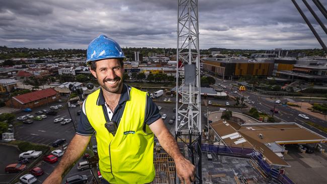 Hutchinson Builders site manager Damian Mills gets a birds-eye view of the progress of the Bernoths development from a construction crane at the inner-city apartments build in Mylne St, Friday, October 14, 2022. Picture: Kevin Farmer