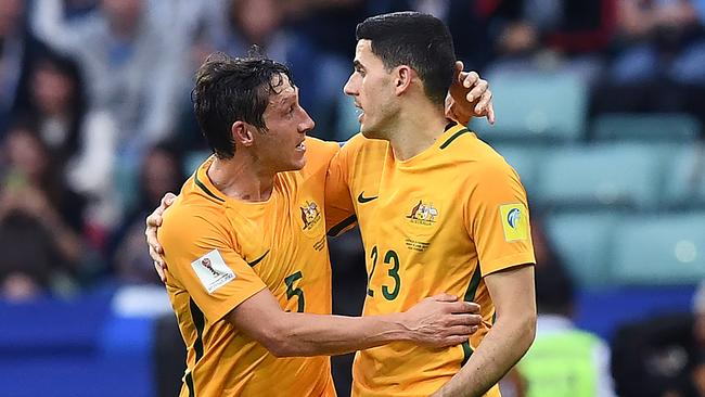 Australia's forward Tommy Rogic (R) is congratulated by midfielder Mark Milligan after scoring a goal during the 2017 Confederations Cup group B football match between Australia and Germany.