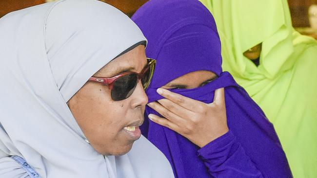 Zainab Abdirahman Khalif, centre, leaving the Supreme Court in Adelaide today. Picture: AAP Image/Roy Vandervegt