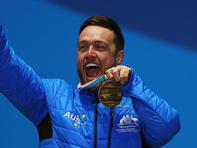 PYEONGCHANG-GUN, SOUTH KOREA - MARCH 12:  Gold Medalist Simon Patmore of Australia celebrates  during the medal ceremony for the Men's Snowboard Cross SB-UL during day three of the PyeongChang 2018 Paralympic Games on March 12, 2018 in Pyeongchang-gun, South Korea.  (Photo by Naomi Baker/Getty Images)