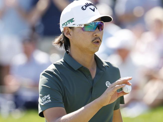 PONTE VEDRA BEACH, FLORIDA - MARCH 13: Min Woo Lee of Australia reacts on the ninth green during the first round of THE PLAYERS Championship on the Stadium Course at TPC Sawgrass on March 13, 2025 in Ponte Vedra Beach, Florida. (Photo by Cliff Hawkins/Getty Images)