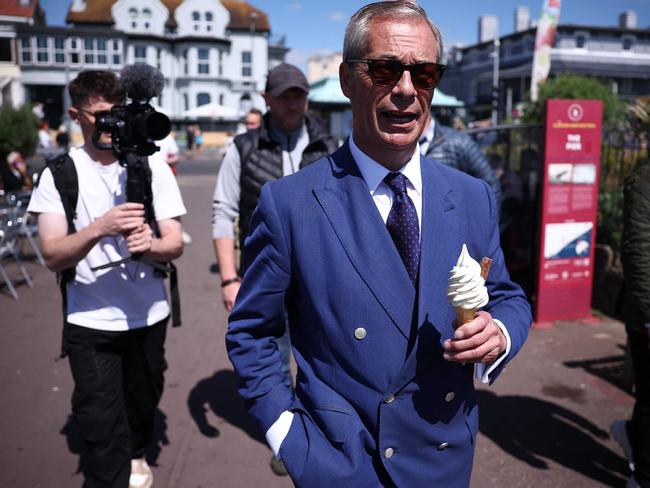 Reform UK leader Nigel Farage walking in Clacton-on-Sea, eastern England. Picture: AFP