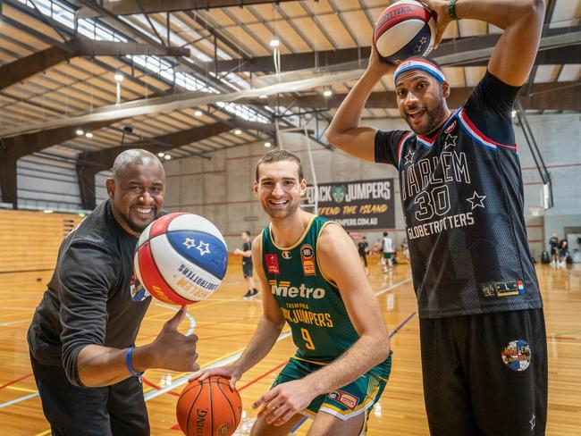 Harlem Globetrotters Scooter Christensen (left) and Zeus McClurkin (right) join JackJumper Jack McVeigh for a shootaround in Kingston. Picture: Tasmania JackJumpers