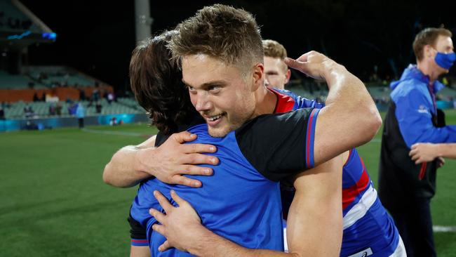 Josh Schache gets a hug from Bulldogs coach Luke Beveridge.