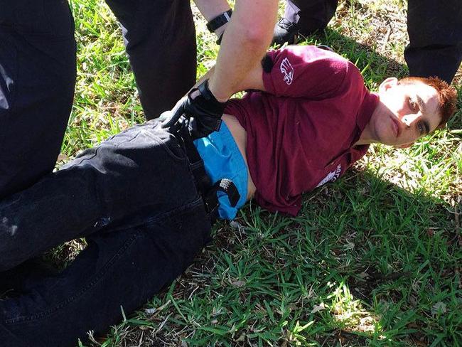 The moment Nikolas Cruz, 19, was taken into custody by law enforcement after allegedly killing 17 at Marjory Stoneman Douglas High School in Broward County, Florida. Picture: WPTV West Palm Beach