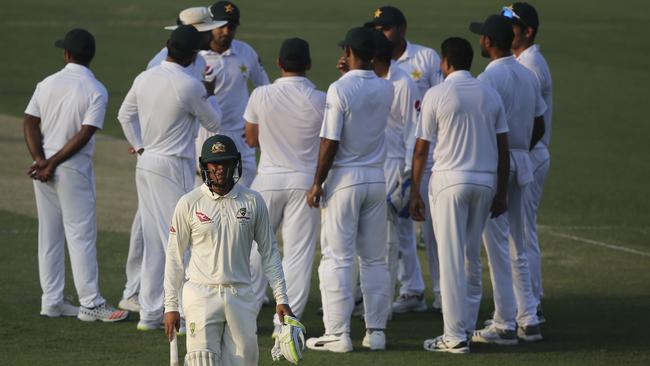 Usman Khawaja trudges off after being dismissed late on day one. Picture: AP