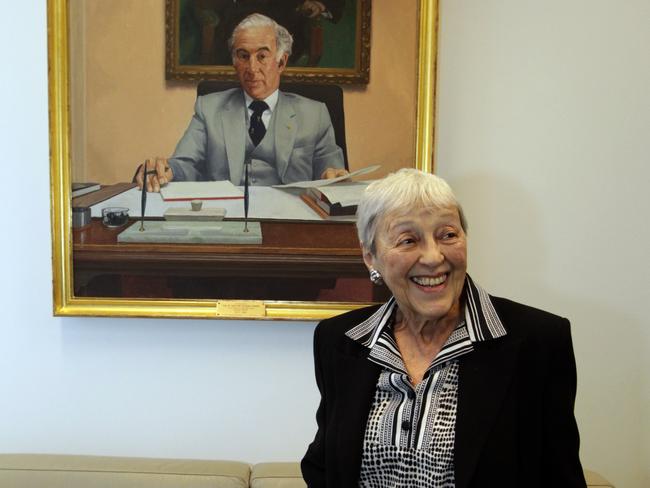 Lady Anna Cowen, wife of the late Sir Zelman Cowen, with a painting of Sir Zelman in the Canberra parliamentary office of Member for Kooyong Josh Frydenberg.