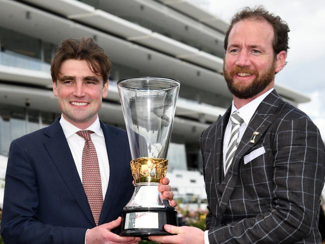 MELBOURNE, AUSTRALIA - OCTOBER 30:  (L-R) Trainers David Eustace and Ciaron Maher of #9 Hitotsu, pose with the Victoria Derby trophy after jockey John Allen won race 6, the Penfolds Victoria Derby during 2021 AAMI Victoria Derby Day at Flemington Racecourse on October 30, 2021 in Melbourne, Australia. (Photo by Vince Caligiuri/Getty Images)
