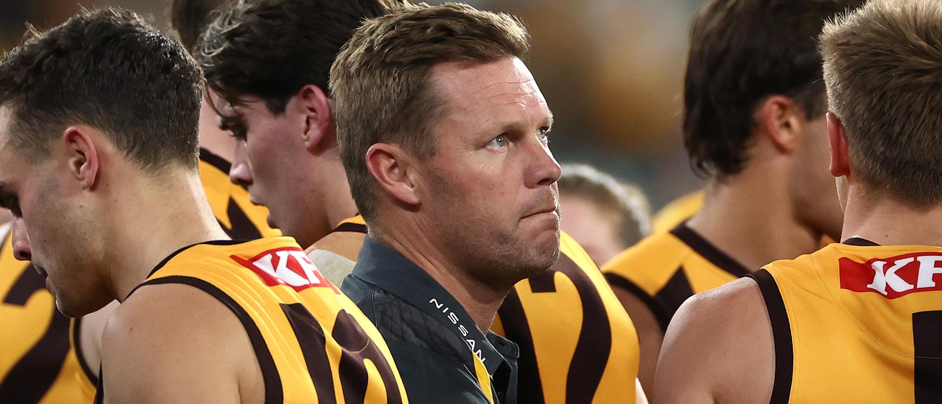 MELBOURNE, AUSTRALIA - APRIL 28: Sam Mitchell, Senior Coach of the Hawks talks to his players during the round seven AFL match between Hawthorn Hawks and Sydney Swans at Melbourne Cricket Ground, on April 28, 2024, in Melbourne, Australia. (Photo by Quinn Rooney/Getty Images)