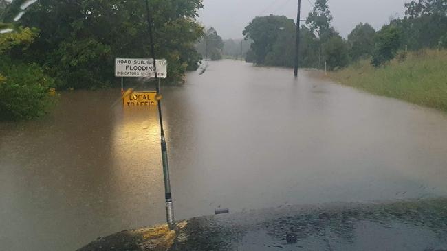 Morrows Road at Nana Glen under water on Monday.