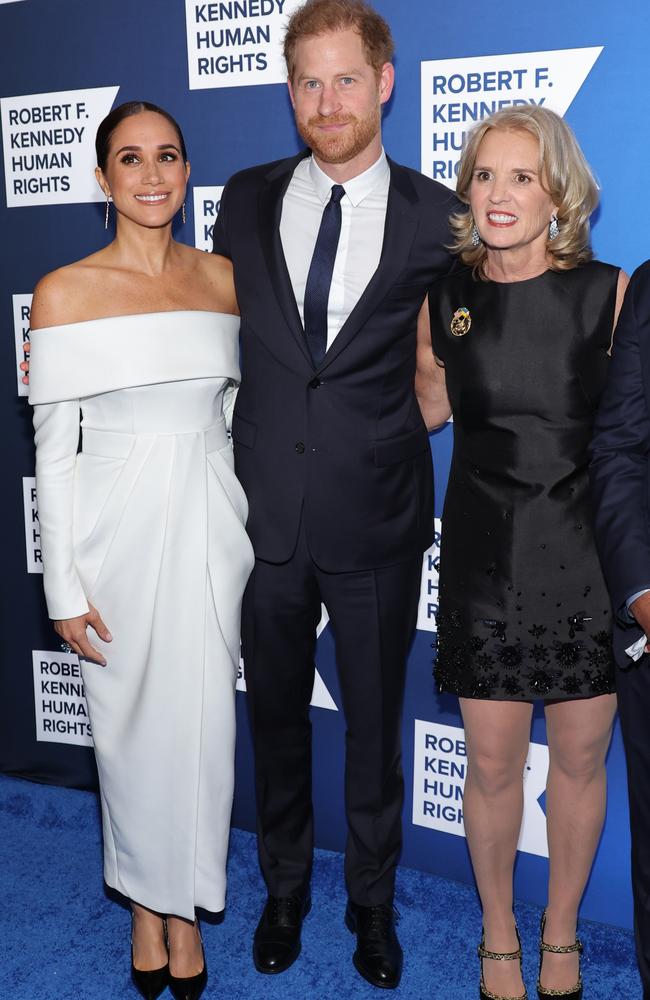 Meghan and Harry pose with Kerry Kennedy, daughter of Robert F. Kennedy, who presented the couple with the honour. Picture: Mike Coppola/Getty Images