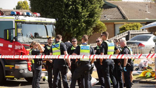 A large contingent of police were on site to assist firefighters battling the house fire in Chaffey Square, Corio. Picture: Alison Wynd