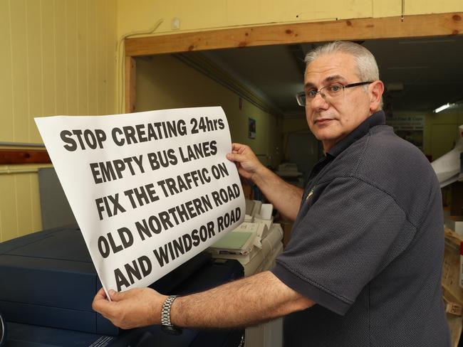 Business owner Joe Laviano is angry after being told a "peak hour" bus lane outside their shops on Old Northern Rd will be changed to a 24 hour bus lane, and they will lose parking for their customers. Picture: David Swift