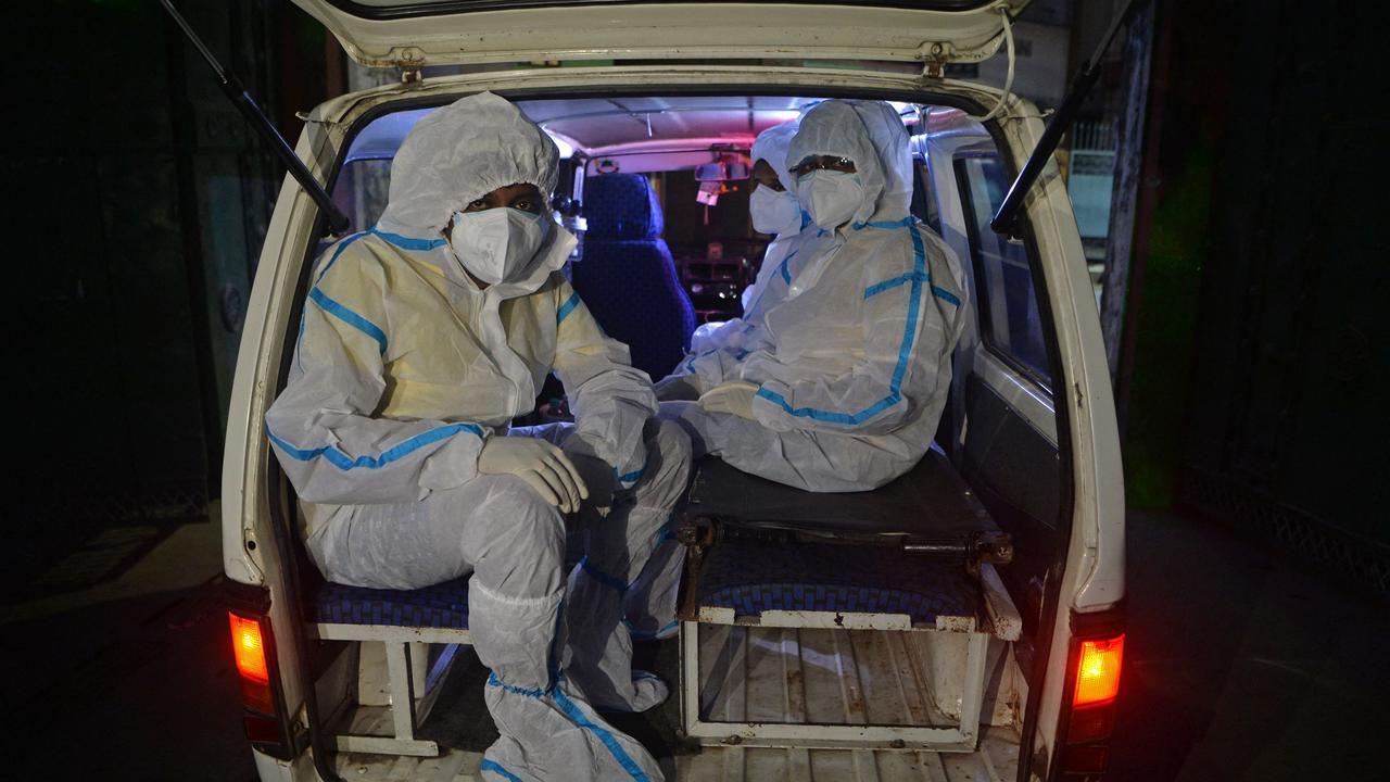 Infected patients in an ambulance in Siliguri in West Bengal, India. Picture: Diptendu Dutta/AFP