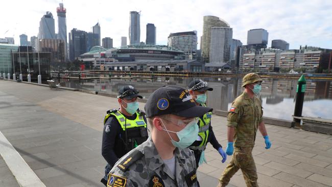 Police and Australian Defence Force personnel patrol Melbourne enforcing stage four lockdown orders. Picture: NCA NewsWire/David Crosling