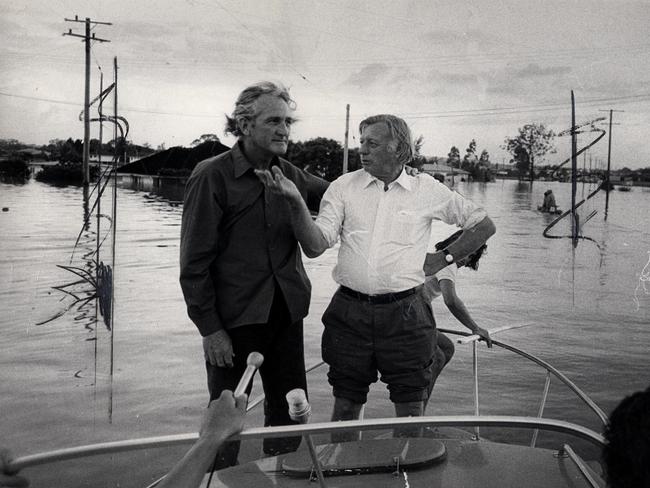 Federal Minister for Urban and Regional Development Tom Uren with Brisbane mayor Clem Jones (R) inspecting the flood damage.