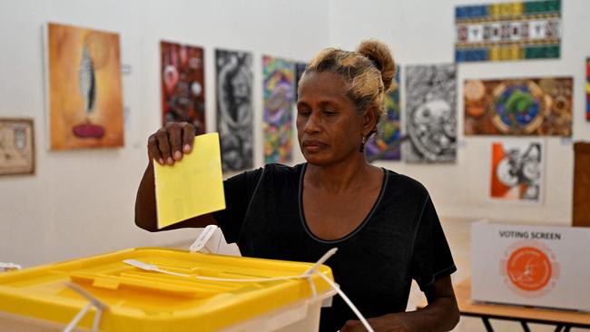 A woman votes in Honiara on Wednesday. Picture: AFP