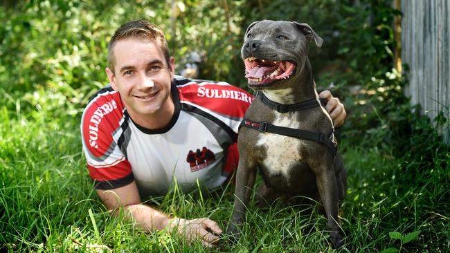 Townsville soldier Brian Heilbronn has been named a Soldier on Service Ambassador for his work raising funds and awareness for PTSD sufferers. Brian Heilbronn with pooch Buster