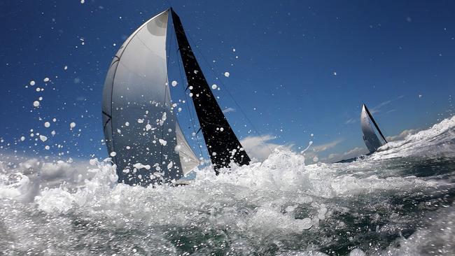 Sydney to Hobart yachts racing up the harbour during the 2021 SOLAS Big Boat Challenge.