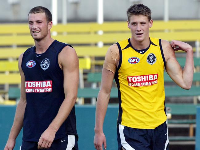 Carlton players Karl Norman with Laurence Angwin in 2004.