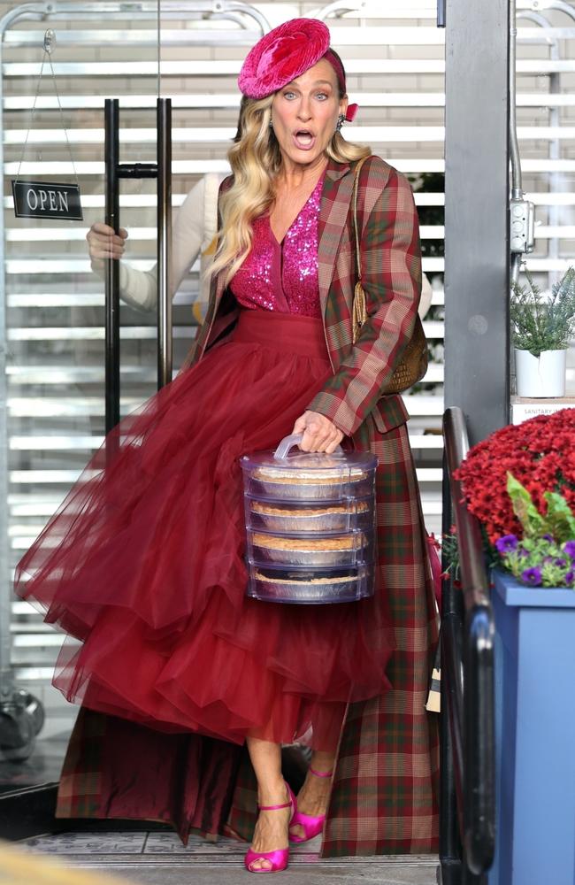 Sarah Jessica Parker as an overdressed Carrie Bradshaw picking up some pies for a scene from ‘And Just Like That’. Picture: Backgrid