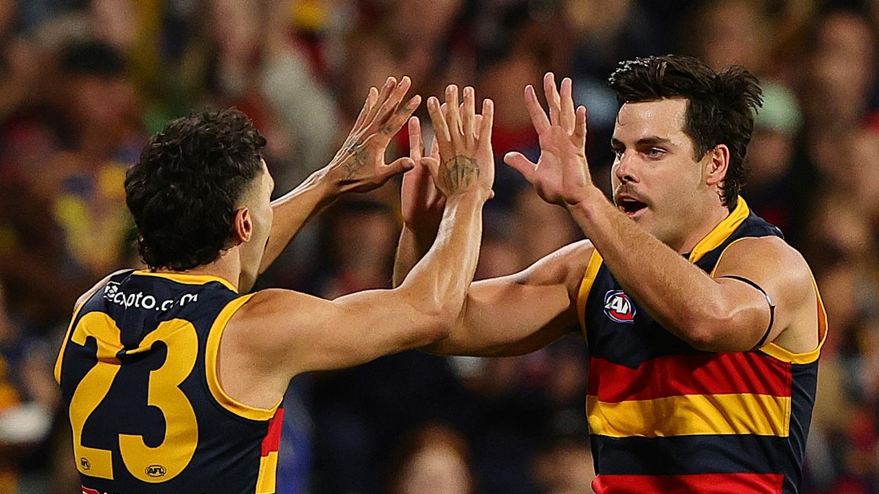 ADELAIDE, AUSTRALIA - MARCH 22: Darcy Fogarty of the Crows celebrates a goal with Izak Rankine of the Crows during the 2024 AFL Round 2 match between the Adelaide Crows and the Geelong Cats at Adelaide Oval on March 22, 2024 in Adelaide, Australia. (Photo by Sarah Reed/AFL Photos via Getty Images)